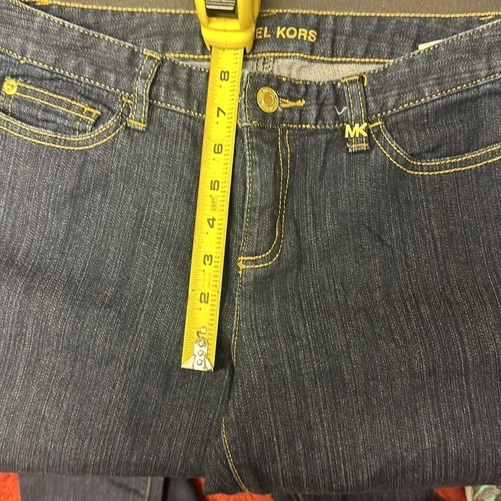 94.  Michael Kors dark blue skinny jeans with embellished pockets size 4